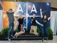 Attendees in front the AAS sign at AAS 234, St. Louis, Missouri.